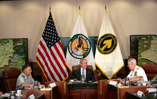 President George W. Bush joins Admiral William Fallon, right, Commander of the U.S. Central Command, and General Doug Brown, Commander U.S. Special Operations Command, during a visit Tuesday, May 1, 2007, to CENTCOM at MacDill Air Force Base in Tampa, Fla. White House photo by Eric Draper
