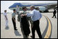 President George W. Bush walks with General David Petraeus, Commander of Multinational Force Iraq, as he prepares to board Air Force One Tuesday, May 1, 2007, after visiting CENTCOM at MacDill Air Force Base in Tampa, Fla. White House photo by Eric Draper