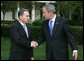 President George W. Bush and Colombia's President Alvaro Uribe exchange handshakes after delivering remarks Wednesday, May 2, 2007, on the South Lawn. President Uribe's visit underscores the friendship and extensive cooperation between the two countries. White House photo by Joyce Boghosian