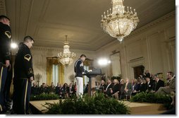 Cadet Chaplain Eun-Jae Yu, of the Virginia Tech Corps of Cadets, delivers the 2007 Prayer for the Nation to President George W. Bush and guests during an observance Thursday, May 3, 2007, of National Prayer Day in the East Room of the White House. White House photo by Eric Draper