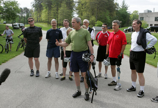 President George W. Bush stands with member of the President's Council on Physical Fitness and Sports as he addresses the press before a bike ride in Beltsville, Md., Saturday, May 5 , 2007. "Today I'm going to ride with a group of friends on a mountain bike," said the President in his remarks about May being Physical Fitness Month, "But the message to all Americans is to find time in your schedule to walk, run, swim, bike, to take care of yourselves." White House photo by Joyce Boghosian