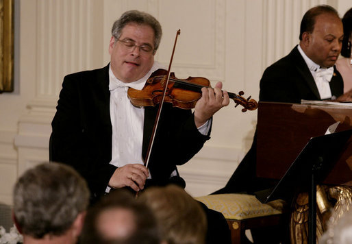 Violinist Itzhak Perlman plays during the entertainment portion of the White House State Dinner in honor on Her Majesty Queen Elizabeth II, Monday evening, May 7, 2007, in the East Room at the White House. White House photo by Shealah Craighead