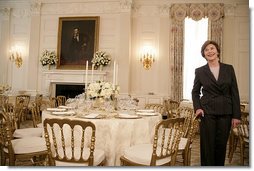 Mrs. Laura Bush describes the table setting arrangements for members of the media for the State Dinner at the White House Monday, May 7, 2007, hosted by President George W. Bush and Mrs. Bush in honor of Her Majesty Queen Elizabeth II and His Royal Highness The Prince Philip, Duke of Edinburgh. White House photo by Shealah Craighead