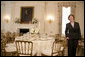 Mrs. Laura Bush describes the table setting arrangements for members of the media for the State Dinner at the White House Monday, May 7, 2007, hosted by President George W. Bush and Mrs. Bush in honor of Her Majesty Queen Elizabeth II and His Royal Highness The Prince Philip, Duke of Edinburgh. White House photo by Shealah Craighead