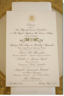 A menu is seen atop a table setting arrangement for the State Dinner at the White House Monday, May 7, 2007, hosted by President George W. Bush and Mrs. Laura Bush in honor of Her Majesty Queen Elizabeth II and His Royal Highness The Prince Philip, Duke of Edinburgh, in the State Dining Room. White House photo by Shealah Craighead