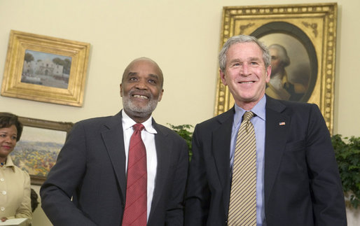 President George W. Bush and President Rene Preval of Haiti stand in the Oval Office Tuesday, May 8, 2007, during a photo opportunity with the media. The leaders were expected to discuss a range of issues, including recent efforts by the United Nations stabilization mission in Haiti to enhance security and opportunities for promoting growth and prosperity in Haiti. White House photo by Joyce Boghosian