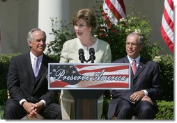 Mrs. Laura Bush is joined by U.S. Secretary of the Interior Dirk Kempthrone, left, and Jon Nau III, chairman of the Advisory Council on Historic Preservation, as she addreses guests in the White House Rose Garden, Wednesday, May 9, 2007, during the Preserve America President Awards ceremony.  White House photo by Joyce N. Boghosian
