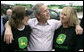 President George W. Bush offers some encouragement to two employees of the John Deere dealership in Greensburg, Kansas Wednesday, May 9, 2007, during a tour of the small, Midwest community that lost nearly 95 percent of its homes and businesses in the wake of a deadly tornado. White House photo by Eric Draper