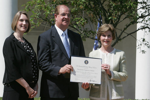 Mrs. Laura Bush poses with Mayor Wayne McCullen of Natchitoches, La., center, and Nancy Morgan, Cane River National Hertiage Area commission executive director, as she presents them with a 2007 Preserve America Presidential Award in the Rose Garden at the White House Wednesday, May 9, 2007, honored for their implementation of a comprehensive hertiage tourism plan for their region. White House photo by Joyce Boghosian