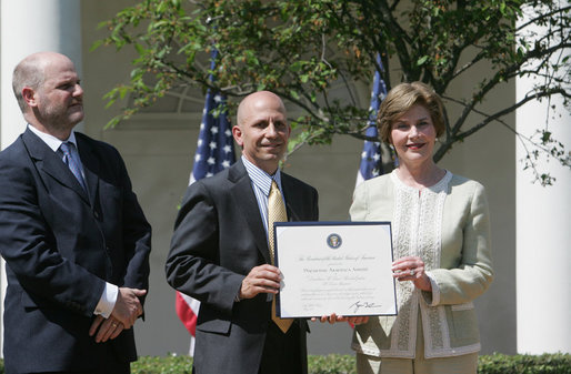 Mrs. Laura Bush presents a plaque to Craig Heller, center, president of Loftworks and John Steffen, left, president of Pyramid Construction, honoring them with a 2007 Preserve America Presidential Award in the Rose Garden at the White House Wednesday, May 9, 2007. The Steffen and Heller companies were honored for their work in preserving and revitalizing the historic downtown of St. Louis, Mo. White House photo by Joyce Boghosian