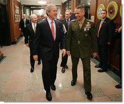 President George W. Bush is welcomed to the Pentagon by Joint Chiefs Chairman Gen. Peter Pace Thursday, May 10, 2007 in Arlington, Va., where President Bush met with U.S. Defense Secretary Robert Gates and members of the Joint Chiefs of Staff.  White House photo by Eric Draper
