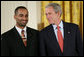 President George W. Bush speaks with award recipient Adeel Khan of Springfield, Va., student body president at Virginia Tech, on stage in the East Room of the White House, where Khan received the President’s Volunteer Service Award Thursday, May 10, 2007, in celebration of Asian Pacific American Heritage Month. White House photo by Eric Draper