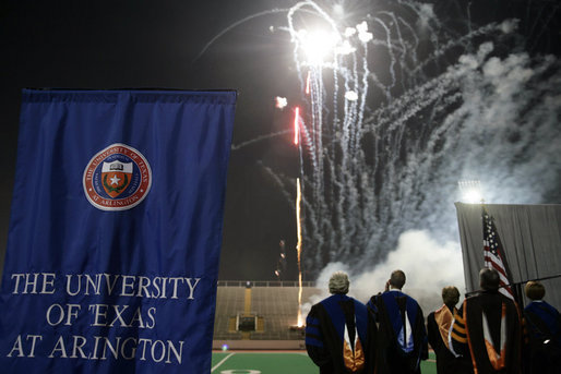 Mrs. Bush, joined by, from left, Dan Formanowicz, Chairman of the Faculty Senate, James Spaniolo, President, UT at Arlington, Robert Estrada, Member, UT System Board of Regents, Dana Dunn, University Provost and Vice President for Academic Affairs, watch fireworks at the conclusion of the 2007 Graduation Celebration event at The University of Texas at Arlington on Friday, May 11, 2007, in Arlington, Texas. During remarks that Mrs. Bush delivered, she said, “ Class of 2007, keep this commitment to others now that you’ve graduated. There are so many people who need your help. Continue your tradition of service to our nation.” White House photo by Shealah Craighead