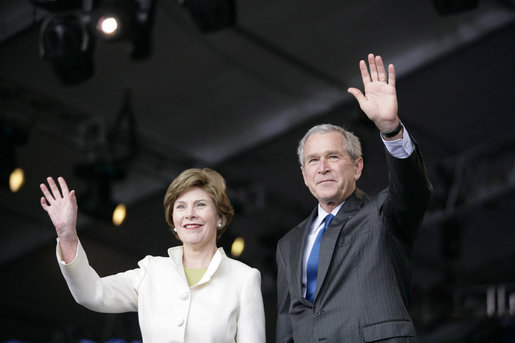 President George W. Bush and Mrs. Laura Bush wave Sunday, May 13, 2007, as they arrive at Anniversary Park in Williamsburg, Va., where the President delivered a speech in celebration of the 400th anniversary of the Jamestown Settlement. "Today we have no closer ally than the nation we once fought for our independence," said the President. "Britain and American are united by our democratic heritage, and by the history that began at this settlement 400 years ago." White House photo by Shealah Craighead