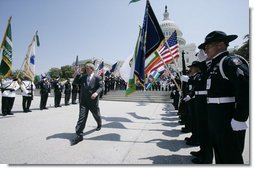 President George W. Bush salutes the color guard as he arrives at the annual Peace Officers’ Memorial Service outside the U.S. Capitol Tuesday, May 15, 2007, paying tribute to law enforcement officers who were killed in the line of duty during the previous year and their families. White House photo by Joyce N. Boghosian