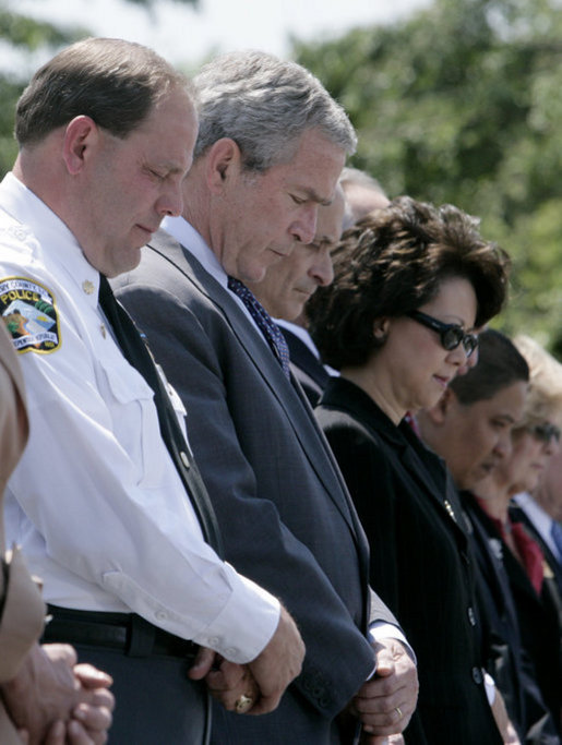 President George W. Bush bows his head during the invocation at the annual Peace Officers' Memorial Service outside the U.S. Capitol Tuesday, May 15, 2007, paying tribute to law enforcement officers who were killed in the line of duty. White House photo by Joyce Boghosian