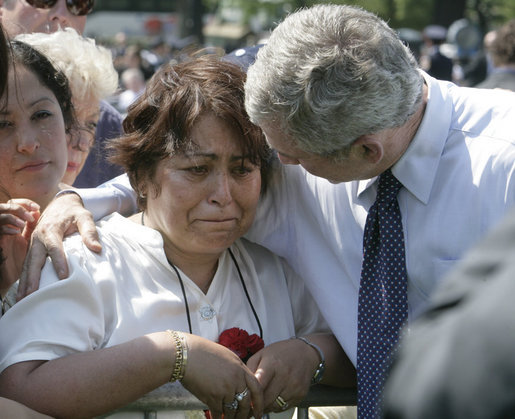 President George W. Bush comforts a family member of a fallen law enforcement officer at the annual Peace Officers' Memorial Service at the U.S. Capitol Tuesday, May 15, 2007. White House photo by Joyce Boghosian