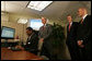 President George W. Bush is joined by Secretary Michael Chertoff, right, of the Department of Homeland Security, and Secretary Carlos Gutierrez of the Department of Commerce, as they look on during a demonstration Wednesday, May 16, 2007, of the Basic Pilot/Employment Eligibility Verification System, a voluntary program managed by U.S. Citizenship and Immigration Services that allows employers to electronically verify the eligibility of newly hired employees. The demonstration, led by Glenda Wooten-Ingram, Director of Human Resources, was held at the Embassy Suites Washington, D.C.-Convention Center, and was followed by a roundtable discussion of the program. White House photo by Joyce Boghosian