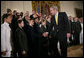 President George W. Bush congratulates newly commissioned members of the Joint Reserve Officer Training Corps Thursday, May 17, 2007, in the East Room of the White House, after U.S. Secretary of Defense Robert Gates administered the commissioning oath to the ROTC members. White House photo by Eric Draper