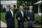 President George W. Bush, center, joined by Homeland Security Secretary Michael Chertoff, left, and Commerce Secretary Carlos Gutierrez, right, makes a statement on immigration reform Thursday, May 17, 2007 on the South Lawn of the White House. "I want to thank the members of the Senate who worked hard, said President Bush. "I appreciate the leadership shown on both sides of the aisle. As I reflect upon this important accomplishment, important first step toward a comprehensive immigration bill, it reminds me of how much the Americans appreciate the fact that we can work together -- when we work together they see positive things."  White House photo by Joyce N. Boghosian