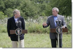 President George W. Bush gestures during a joint press availability Monday, May 21, 2007, with NATO Secretary-General Jaap de Hoop Scheffer at the Bush Ranch in Crawford, Texas. White House photo by Eric Draper