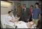 President George W. Bush shakes the hand of Cpl. Ryan T. Dion of Manchester, Conn., after awarding him a Purple Heart Thursday, May 25, 2007, during a visit to the National Naval Medical Center in Bethesda, Md., where the Marine is recovering from wounds received in Operation Iraqi Freedom. With them are Cpl. Dion's parents, Thomas and Patricia Dion, and brother, Justin. White House photo by Joyce N. Boghosian