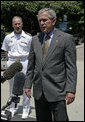 President George W. Bush talks to the press after visiting with patients at National Naval Medical Center Friday, May 25, 2007, in Bethesda, Md. "I also am honored to be here at this place of compassion and healing on Memorial Day Weekend," said President Bush. "It's a weekend which gives us a chance to honor those who have served this country, whether it be in this war or in previous wars." White House photo by Joyce N. Boghosian