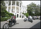 President George W. Bush bids farewell to members of the Rolling Thunder motorcycle organization, as they drive away from the South Portico of the White House following their visit Sunday, May 27, 2007. Rolling Thunder, founded by a group of Vietnam veterans in 1987, marks its 20th year of supporting U.S. troops overseas, at home and missing in action. White House photo by Chris Greenburg