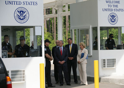 President George W. Bush listens as Ed Cassidy, Assistant Director of U.S. Customs and Border Protection, explains the procedures at a simulated border crossing during in a tour Tuesday, May 29, 2007, of the Federal Law Enforcement Training Center in Glynco, Ga. The President spent the day in Georgia where he was briefed on wildfires and also delivered remarks on comprehensive immigration reform. White House photo by Eric Draper