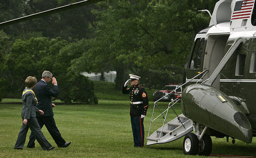 President George W. Bush salutes as he and Mrs. Laura Bush board Marine One Monday, June 4, 2007, on the South Lawn. The President and Mrs. Bush are traveling to Europe this week. They will visit the Czech Republic, Poland, Italy, the Vatican, Albania, Bulgaria and attend the G8 Summit in Germany. White House photo by Joyce N. Boghosian