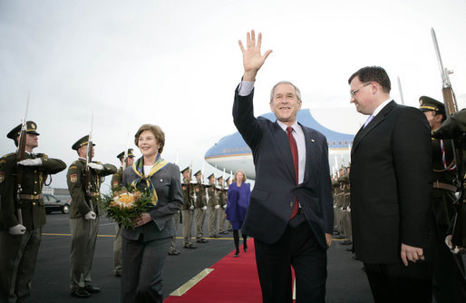 President George W. Bush waves as he and Mrs. Laura Bush arrive Monday, June 4, 2007, at Prague Ruzyne Airport in the Czech Republic where they will begin their seven-day Europe visit. White House photo by Eric Draper