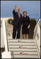 President George W. Bush and Mrs. Laura Bush wave as they arrive Tuesday, June 6, 2007, in Rostock, Germany. The couple will spend the next two days in nearby Heiligendamm, site of this year's G8 Summit. White House photo by Eric Draper