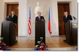 President George W. Bush addresses a joint news conference Tuesday, June 5, 2007, joined by Czech President Vaclav Klaus, right, and Czech Prime Minister Mirek Topolanek, left, at Prague Castle in the Czech Republic. White House photo by Chris Greenberg