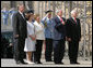 President George W. Bush and Mrs. Laura Bush listen to the U.S. National Anthem on their arrival to Prague Castle in the Czech Republic Tuesday, June 5, 2007, welcomed by Czech President Vaclav Klaus, right; his wife, Livia Klausova and Czech Prime Minister Mirek Topolanek, left. White House photo by Chris Greenberg