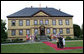 President George W. Bush and Mrs. Laura Bush and German Chancellor Angela Merkel and husband, Dr. Joachim Sauer, wave to the media prior to dinner for the G8 leaders and their spouses Wednesday, June 6, 2007 at Hohen Luckow Estate in Hohen Luckow, Germany. White House photo by Eric Draper