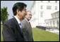 President George W.Bush and Prime Minister Shinzo Abe of Japan conclude their remarks after a brief afternoon meeting Wednesday, June 7, 2007, at the Kempinski Grand Hotel in Heiligendamm, Germany, site of the G8 Summit. White House photo by Eric Draper