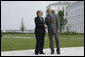 President George W. Bush stands with German Chancellor Angela Merkel as they meet for lunch Wednesday, June 6, 2007, at the Kempinski Grand Hotel in Heiligendamm, Germany. White House photo by Eric Draper