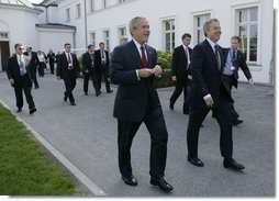 President George W. Bush and Prime Minister Tony Blair of the United Kingdom walk to the Grand Hotel after their meeting Thursday, June 7, 2007, in the Music Salon of the Kempinski Grand Hotel in Heiligendamm, Germany. Among the issues covered, the two leaders discussed AIDS, global warming and Darfur.  White House photo by Eric Draper