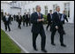 President George W. Bush and Prime Minister Tony Blair of the United Kingdom walk to the Grand Hotel after their meeting Thursday, June 7, 2007, in the Music Salon of the Kempinski Grand Hotel in Heiligendamm, Germany. Among the issues covered, the two leaders discussed AIDS, global warming and Darfur. White House photo by Eric Draper