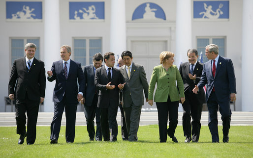 Leaders of the G8 walk across the grass en route to the official photograph Thursday, June 7, 2007, in Heiligendamm, Germany. From left are: Prime Minister Stephen Harper of Canada; Prime Minister Tony Blair of the United Kingdom; Jose Manuel Barroso, President of the European Commission; President Nicolas Sarkozy of France; President Vladimir Putin of Russia; Prime Minister Shinzo Abe of Japan; Chancellor Angela Merkel of Germany; Prime Minister Romano Prodi of Italy, and President George W. Bush. White House photo by Eric Draper