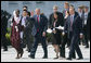 Joined by Prime Minister Tony Blair of the United Kingdom, President George W. Bush waves to the cameras as they walk with Junior G8 Student Leaders including the U.S. representative Kavitha Narra, following their meeting Thursday, June 7, 2007, in Heiligendamm, Germany. The 16-year-old is a junior at San Jose's Harker School and is one of eight students who made the trip to the J8. White House photo by Eric Draper