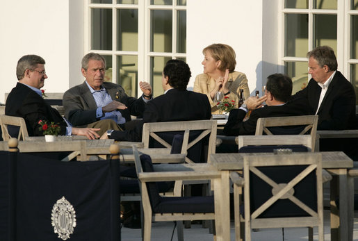 President George W. Bush sits with fellow G8 leaders Thursday afternoon, June 7, 2007, during a reception prior to dinner on the terrace of the Kempinski Grand Hotel in Heiligendamm, Germany. Clockwise from the President are: Chancellor Angela Merkel of Germany; Prime Minister Tony Blair of the United Kingdom; Prime Minister Romano Prodi of Italy; Jose Manuel Barroso, President of the European Commission, and Prime Minister Stephen Harper of Canada. White House photo by Eric Draper