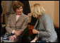 Mrs. Laura Bush shares a moment with Mrs. Laureen Harper prior to a presentation to G8 spouses Thursday, June 7, 2007, at Burg Schlitz in Hohen Demzin, Germany. White House photo by Shealah Craighead