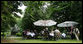 Partners of G8 leaders enjoy coffee Thursday, June 7, 2007, in the Castle Garden at Burg Schlitz in Hohen Demzin, Germany. White House photo by Shealah Craighead