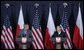 President George W. Bush draws a smile from Poland's President Lech Kaczynski during their joint statement Friday, June 8, 2007, in Gdansk. Said President Bush, "One thing I do want to do is praise this good country for being so strong for freedom. I love to be in a land where people value liberty, and are willing to help others realize the blessings of liberty."  White House photo by Chris Greenberg