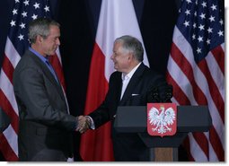 President George W. Bush and President Lech Kaczynski of Poland, shake hands at the conclusion of their joint statement Friday, June 8, 2007, at Gdansk Lech Walesa International Airport in Gdansk.  White House photo by Chris Greenberg