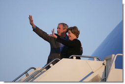 President George W. Bush and Mrs. Laura Bush wave as they board Air Force One for departure from Poland Friday, June 8, 2007, at Gdansk Lech Walesa International Airport in Gdansk.  White House photo by Chris Greenberg