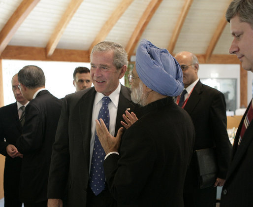 President George W. Bush talks briefly with Prime Minister Manmohan Singh of India, Friday, June 8, 2007, after a G8 working session with Outreach Representatives at the Kempinski Grand Hotel in Heiligendamm, Germany. White House photo by Eric Draper