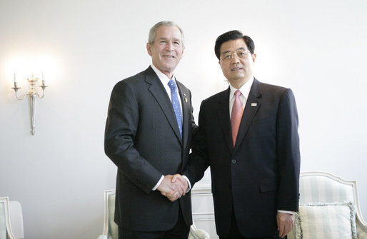 President George W. Bush shakes the hand of President Hu Jintao following their brief meeting Friday, June 8, 2007, prior to the working session of the G8 Summit in Heiligendamm, Germany. White House photo by Eric Draper