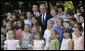 President George W. Bush and Mrs. Laura Bush pose for a photo Saturday, June 9, 2007, with children of employees and staff of the American Embassy in Rome. White House photo by Eric Draper
